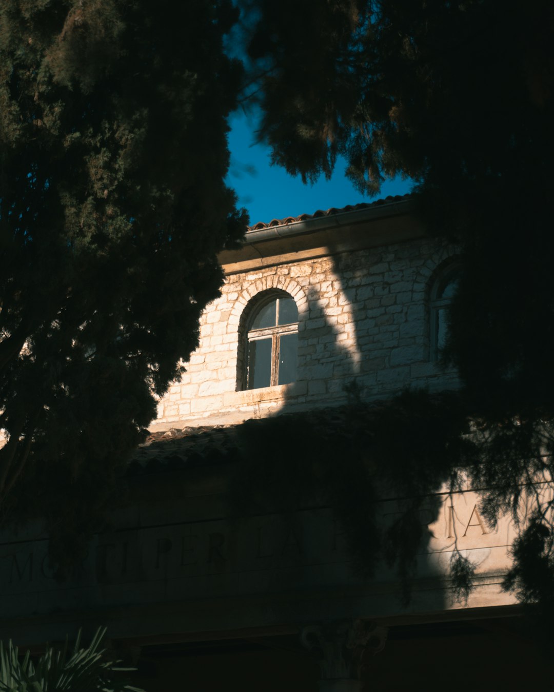 a building with a cross on the top of it